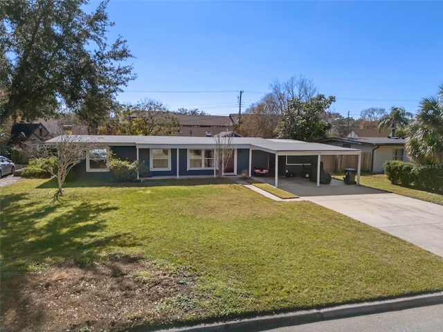 ranch-style home with a front yard and a carport