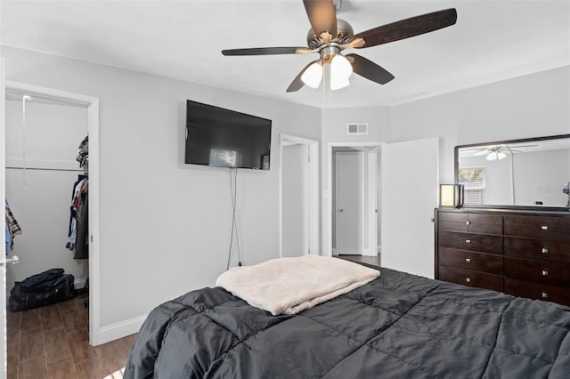 bedroom featuring ceiling fan and a closet