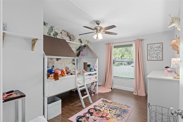 bedroom with ceiling fan and dark hardwood / wood-style flooring