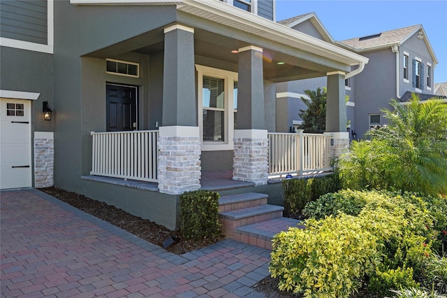 property entrance featuring covered porch