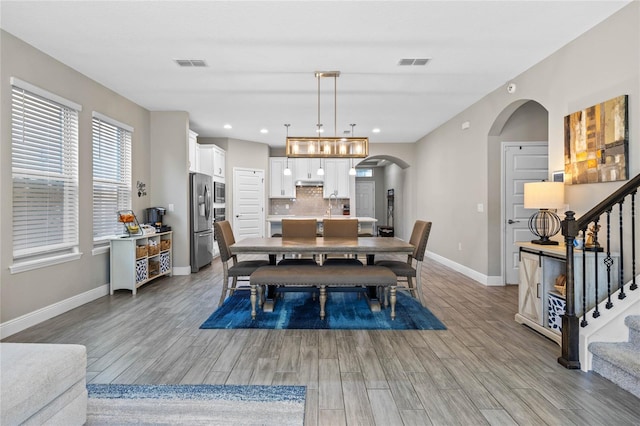 dining area with light wood-type flooring