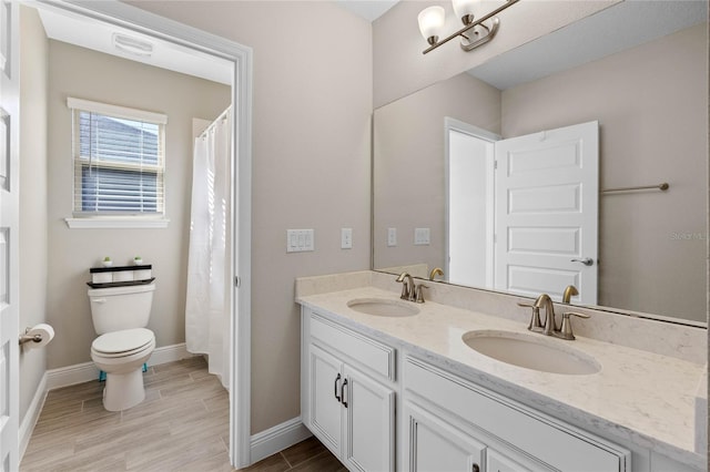 bathroom with vanity and toilet