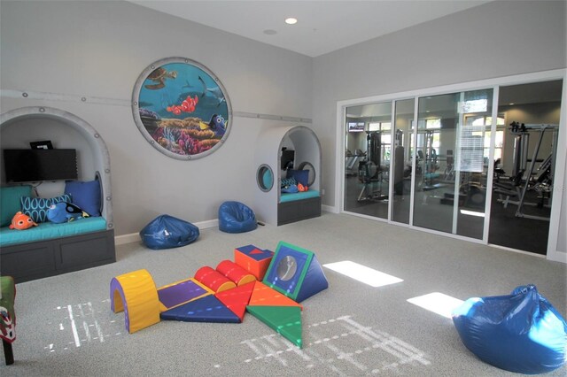 exercise area featuring carpet flooring