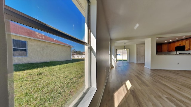 unfurnished living room with hardwood / wood-style floors