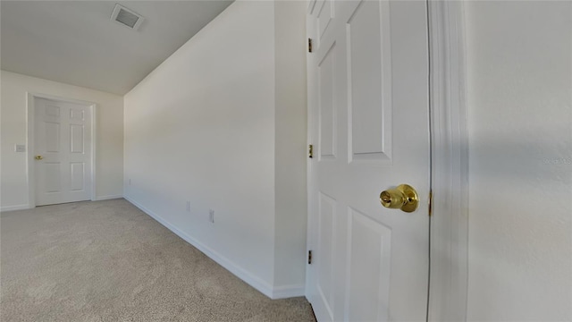 interior space with light colored carpet and lofted ceiling