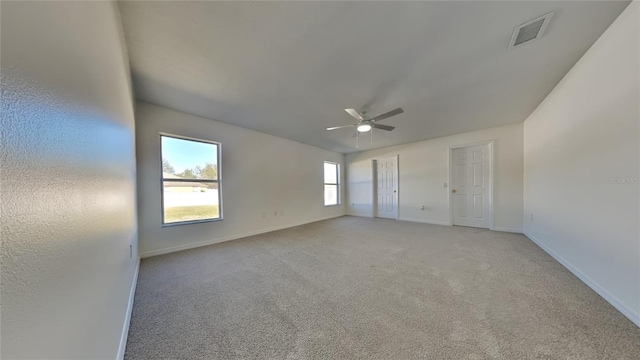 carpeted empty room with ceiling fan