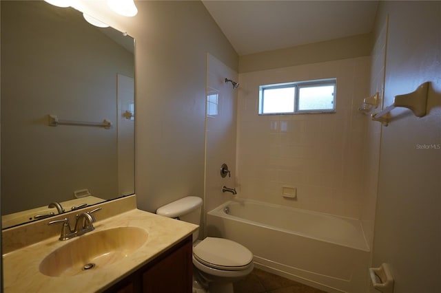 full bathroom featuring vanity, tiled shower / bath combo, tile patterned floors, and toilet