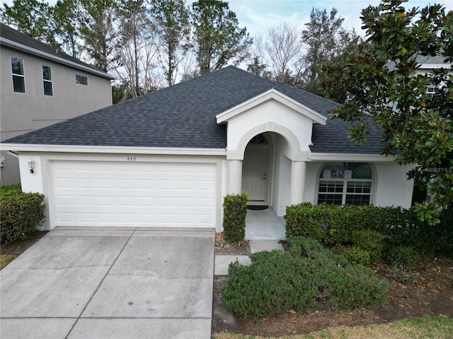 ranch-style house featuring a garage