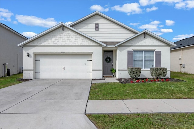 view of front of house with a front lawn and a garage