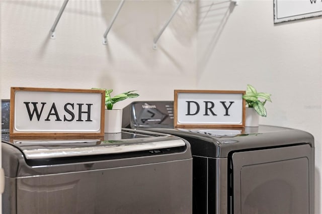 laundry room featuring washing machine and clothes dryer