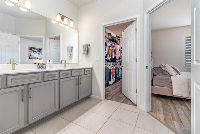 bathroom with vanity and tile patterned floors