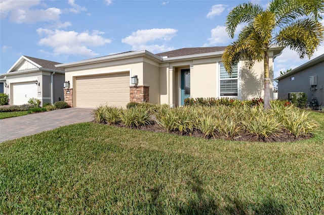 view of front facade featuring a front lawn and a garage