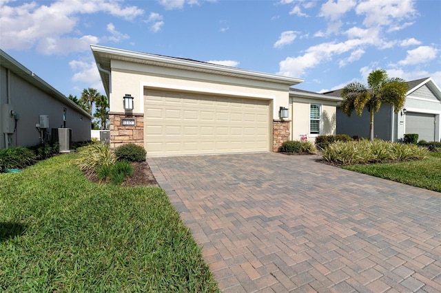 view of front of house featuring central AC and a garage