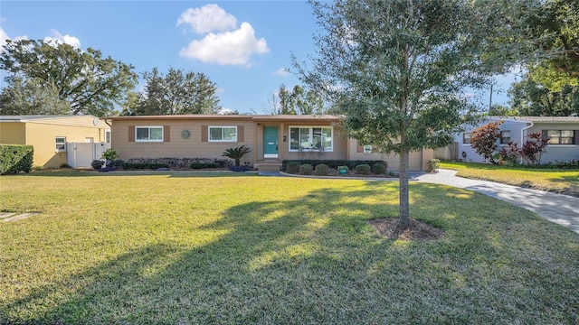 ranch-style home with a front yard