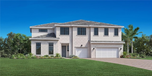 view of front of home with a garage and a front yard