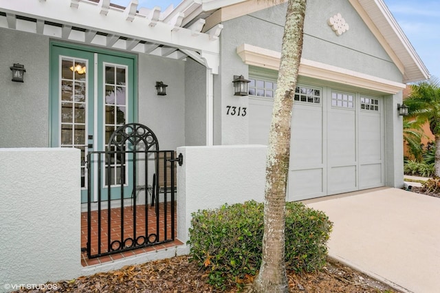 doorway to property featuring a garage