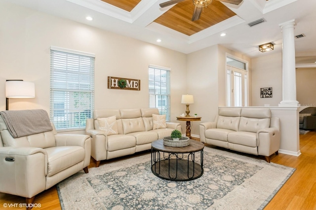 living room with light wood-type flooring, ceiling fan, coffered ceiling, and decorative columns