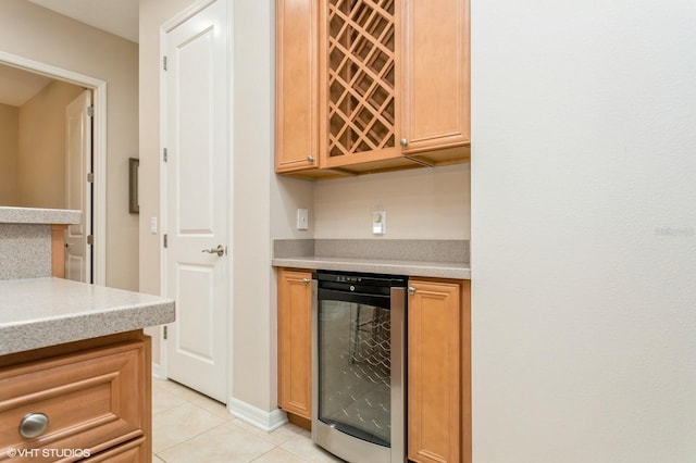 kitchen featuring light tile patterned floors and beverage cooler