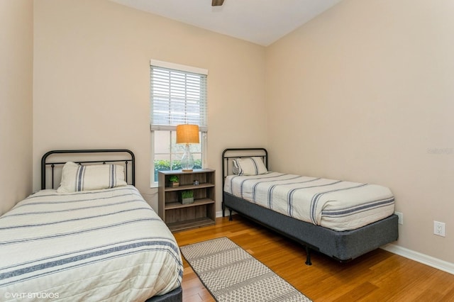 bedroom featuring light wood-type flooring and ceiling fan