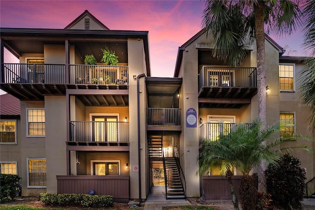 view of outdoor building at dusk