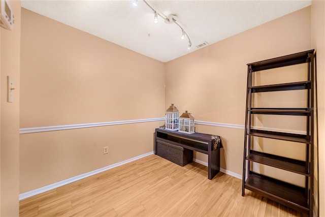 miscellaneous room with light wood-type flooring