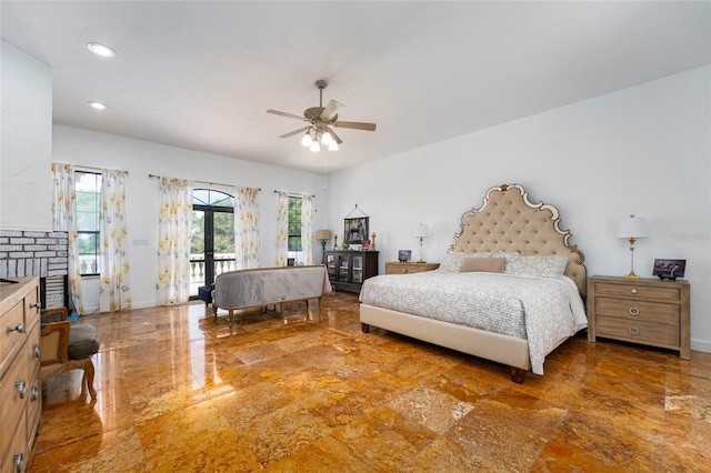 bedroom with access to exterior, french doors, and ceiling fan