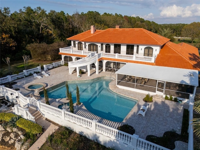 11148 Lane Park Rd, Tavares, FL 32778 - view of pool featuring an in ground hot tub, a sunroom, and a patio