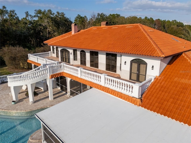 11148 Lane Park Rd, Tavares, FL 32778 - back of house with a swimming pool side deck and a patio