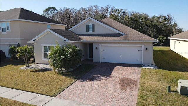 front of property featuring a front yard and a garage