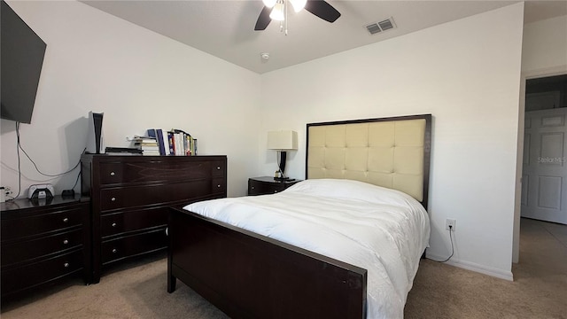 bedroom with ceiling fan and light colored carpet