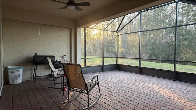 sunroom with a wealth of natural light and ceiling fan