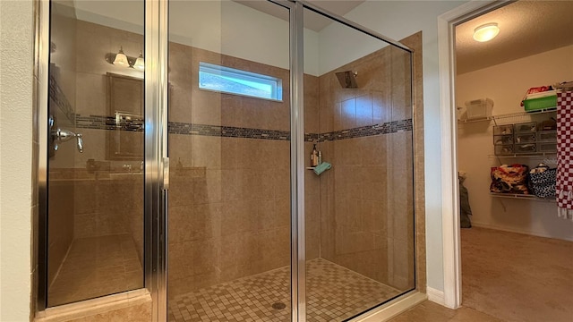 bathroom with a shower with shower door