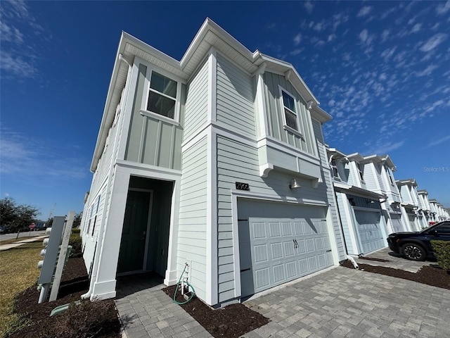 view of side of property featuring a garage