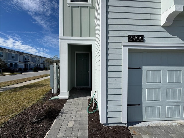 doorway to property featuring a garage