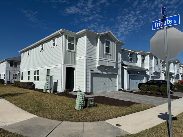 view of front of house with a garage and a front lawn