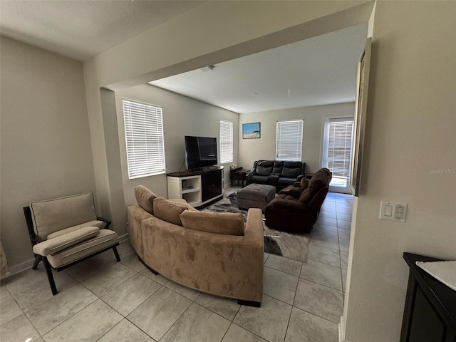 living room with light tile patterned floors