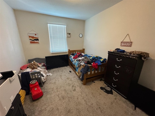 bedroom with light colored carpet