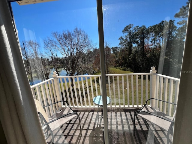 balcony featuring a water view