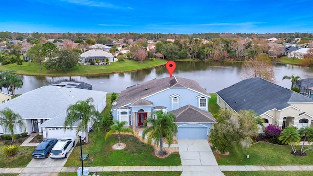 birds eye view of property featuring a water view