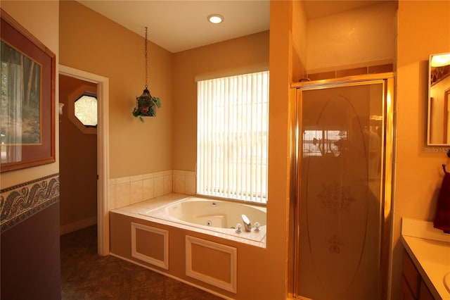 bathroom with tile patterned flooring, shower with separate bathtub, and vanity