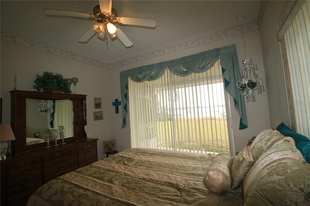 bedroom featuring ceiling fan and multiple windows