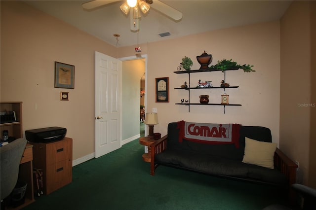 interior space featuring ceiling fan and dark carpet