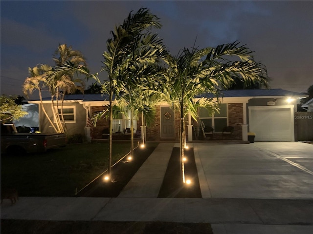 view of front of property with a garage