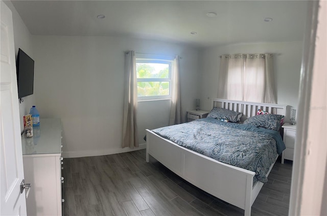 bedroom featuring dark wood-type flooring