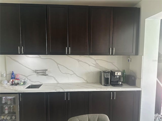 kitchen with light stone counters and decorative backsplash