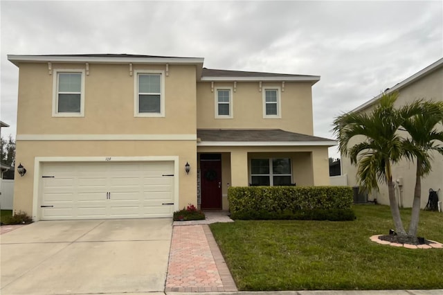 view of front of house featuring a front yard and a garage