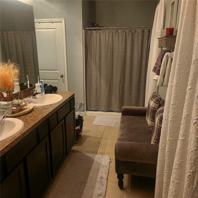 bathroom featuring a shower with shower curtain, tile patterned flooring, and vanity