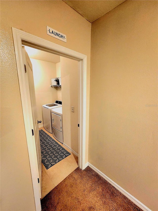 interior space featuring tile patterned floors, baseboards, separate washer and dryer, and carpet floors