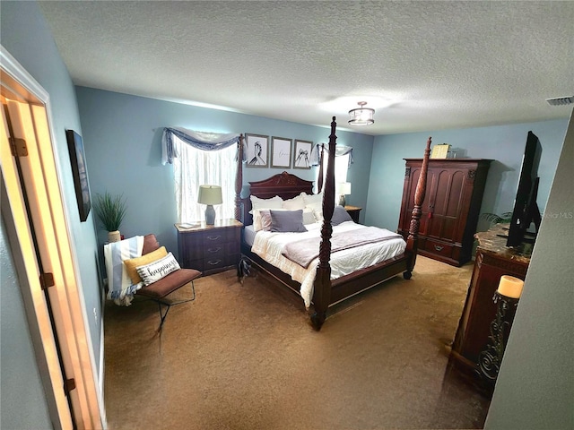 carpeted bedroom with a textured ceiling and visible vents