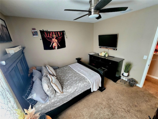carpeted bedroom featuring baseboards, visible vents, and ceiling fan